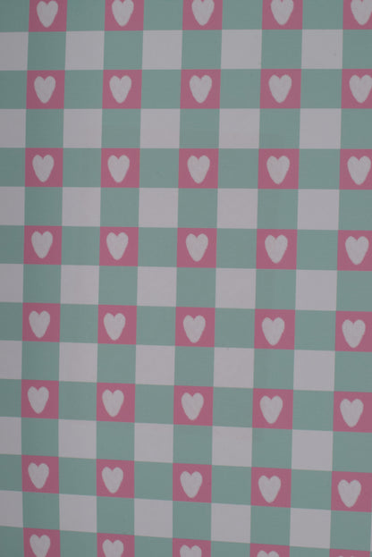 Checkered pattern with hearts on a green and pink background